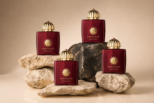 Amouage perfume bottle displayed alongside frankincense resin and oud wood in Oman