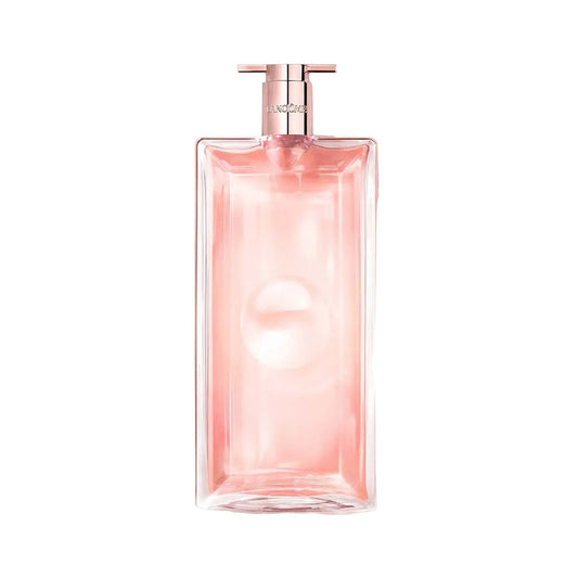 A rectangular glass perfume bottle filled with pink liquid, featuring a metallic rose gold atomizer cap, centered on a solid white background.